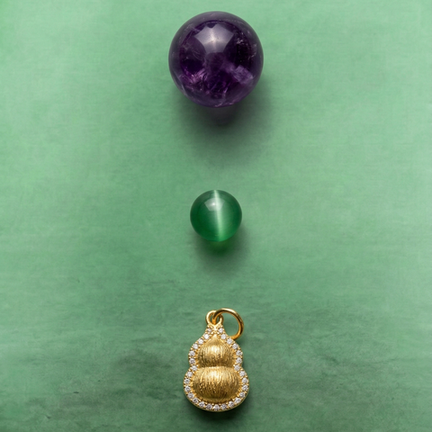 Close-up of AETHER Key: AWARENESS, showing the deep violet Uruguay amethyst, a vibrant green agate bead, and a detailed 925 silver gold-plated Wu Lou pendant.