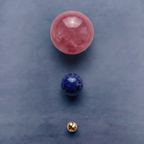 Macro detail of AETHER Key: RESONANCE, showing the jelly-like texture of Madagascar rose quartz, a deep blue lapis lazuli bead, and a brilliant 24k gold-plated spacer.